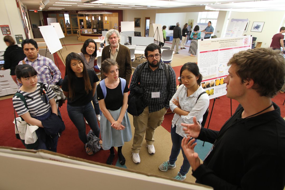 Students at a poster session during GUS 2022