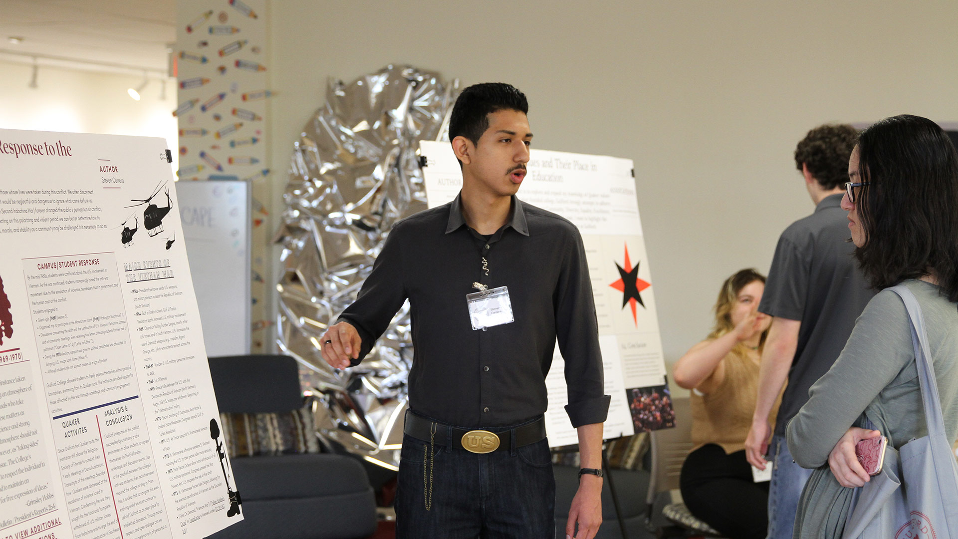 A student presenting research at GUS 2024